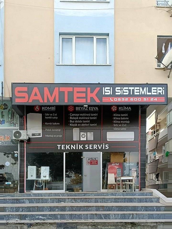 SAMTEK Isı Sistemleri dükkânının binayla birlikte önden görünümü: tabela, vitrin ve giriş basamakları, Atakum, Samsun